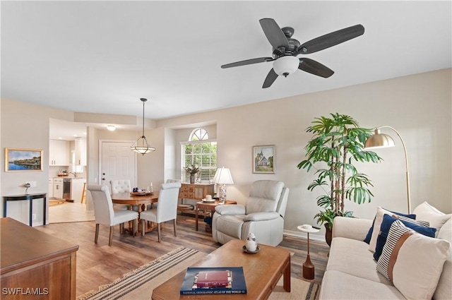 13020 Amberley Ct Unit 301, Bonita Springs, FL 34135 - living area featuring light wood-type flooring and a ceiling fan
