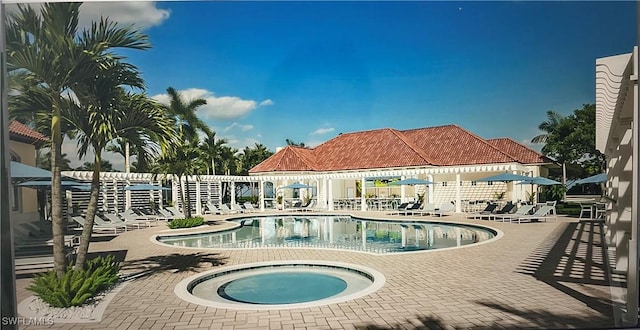 13020 Amberley Ct Unit 301, Bonita Springs, FL 34135 - community pool with a community hot tub and a patio area