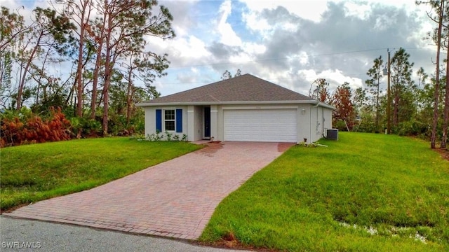 ranch-style house featuring an attached garage, decorative driveway, a front lawn, and stucco siding