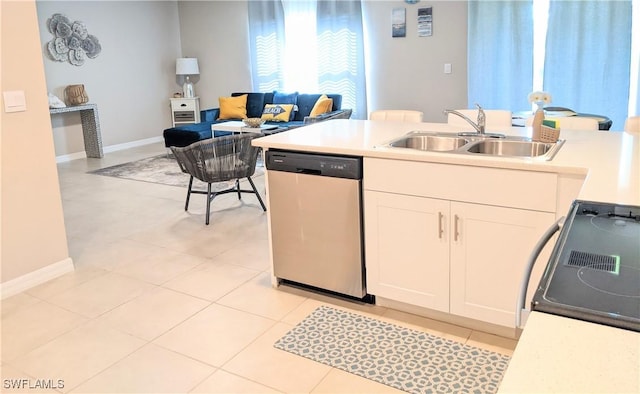 kitchen with dishwasher, a sink, range with electric stovetop, white cabinets, and light countertops