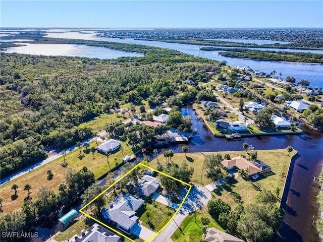 28427 Sabal Palm Dr, Punta Gorda, FL 33982 - aerial perspective of suburban area with a nearby body of water and property boundaries highlighted