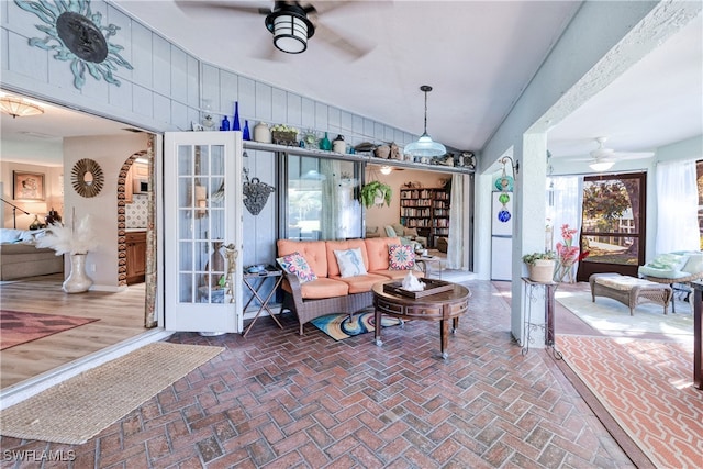 28427 Sabal Palm Dr, Punta Gorda, FL 33982 - living area with a ceiling fan, brick flooring, and lofted ceiling