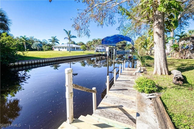 28427 Sabal Palm Dr, Punta Gorda, FL 33982 - dock area with a water view, a lawn, and boat lift