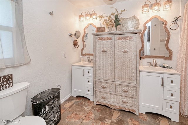 28427 Sabal Palm Dr, Punta Gorda, FL 33982 - bathroom featuring toilet, vanity, baseboards, and a textured wall