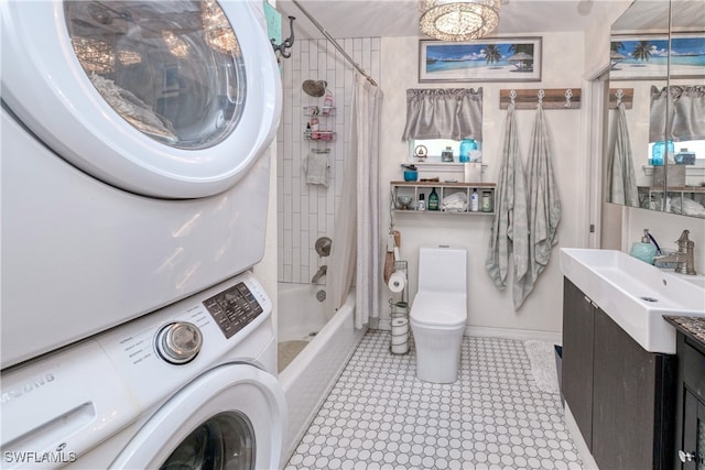 28427 Sabal Palm Dr, Punta Gorda, FL 33982 - full bathroom with stacked washer / dryer, shower / bath combo, vanity, toilet, and a chandelier