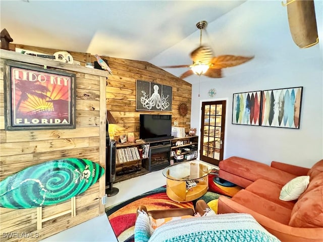 28427 Sabal Palm Dr, Punta Gorda, FL 33982 - living room with wood walls, lofted ceiling, and a ceiling fan