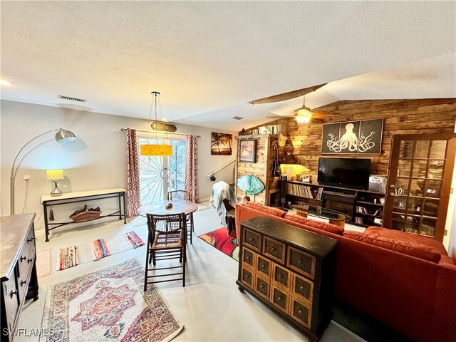 28427 Sabal Palm Dr, Punta Gorda, FL 33982 - office area featuring wooden walls, a textured ceiling, ceiling fan, and vaulted ceiling