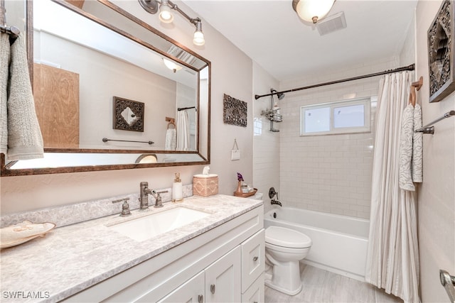 28427 Sabal Palm Dr, Punta Gorda, FL 33982 - bathroom featuring toilet, vanity, and shower / bath combo with shower curtain