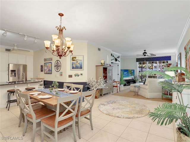 2110 Cay Lagoon Dr Unit 113, Naples, FL 34109 - dining room featuring ceiling fan, crown molding, light tile patterned floors, a chandelier, and track lighting