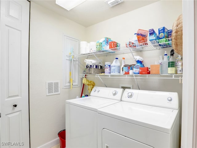 2110 Cay Lagoon Dr Unit 113, Naples, FL 34109 - laundry area with independent washer and dryer and baseboards
