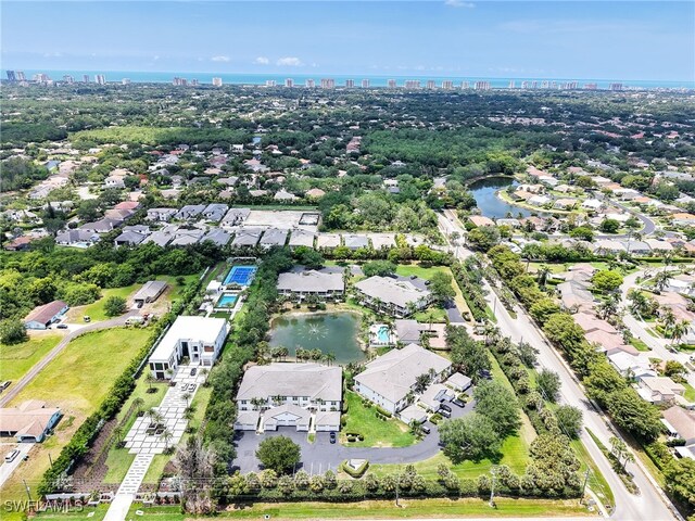 2110 Cay Lagoon Dr Unit 113, Naples, FL 34109 - aerial perspective of suburban area featuring a view of skyline and a nearby body of water