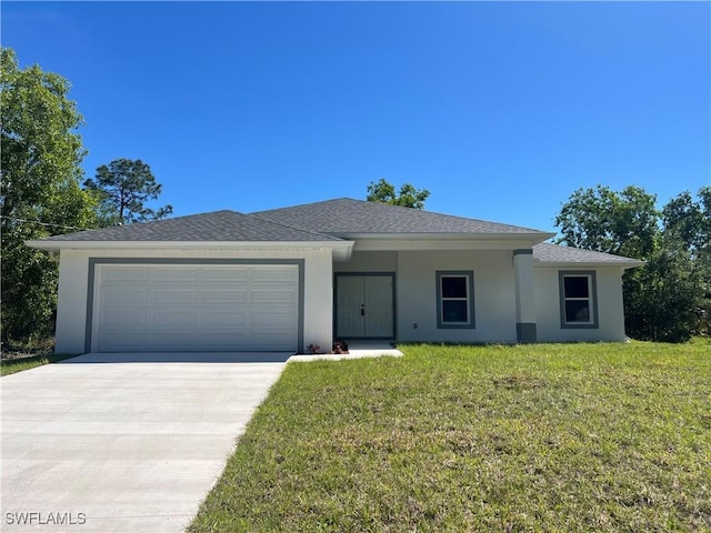 view of front facade with an attached garage, stucco siding, driveway, and a front yard