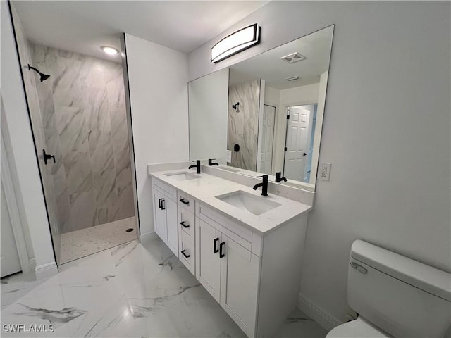 bathroom featuring toilet, a marble finish shower, marble look tiles, and baseboards