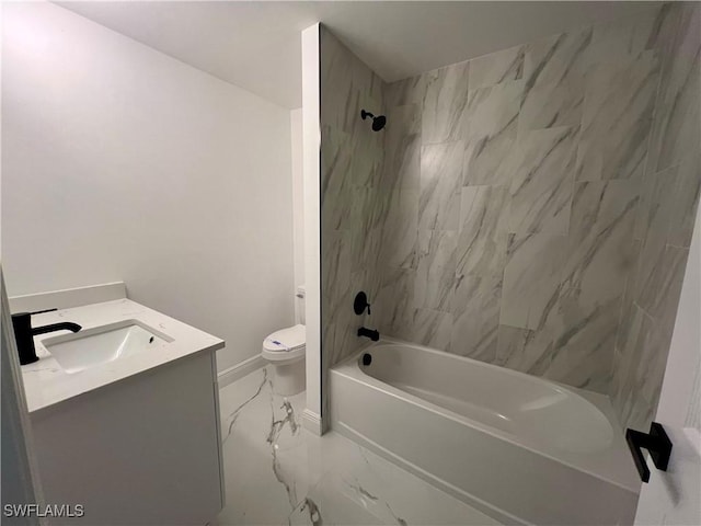 full bath featuring marble look tile flooring, bathtub / shower combination, toilet, vanity, and baseboards