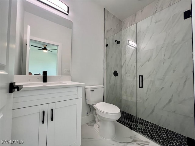 bathroom with marble look tile flooring, a marble finish shower, toilet, vanity, and a ceiling fan