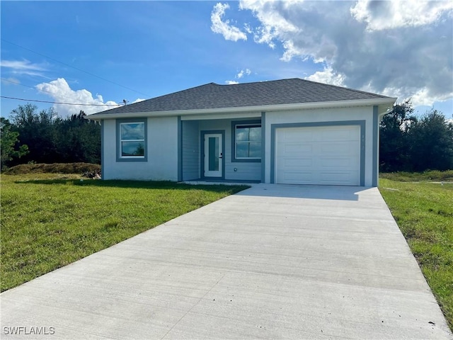 ranch-style home featuring driveway, a front lawn, and a garage