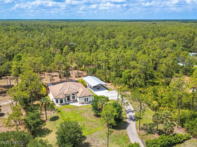 3818 2nd Ave NE, Naples, FL 34120 - view of subject property with a heavily wooded area