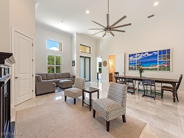 3818 2nd Ave NE, Naples, FL 34120 - living area featuring ornamental molding, a ceiling fan, a high ceiling, light marble finish floors, and recessed lighting