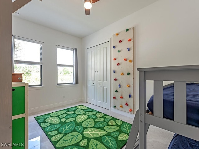 3818 2nd Ave NE, Naples, FL 34120 - bedroom featuring baseboards, ceiling fan, and a closet
