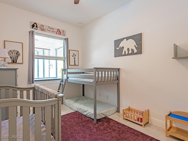 3818 2nd Ave NE, Naples, FL 34120 - carpeted bedroom with a ceiling fan