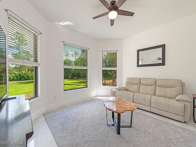 3818 2nd Ave NE, Naples, FL 34120 - living room featuring healthy amount of natural light, ceiling fan, and baseboards