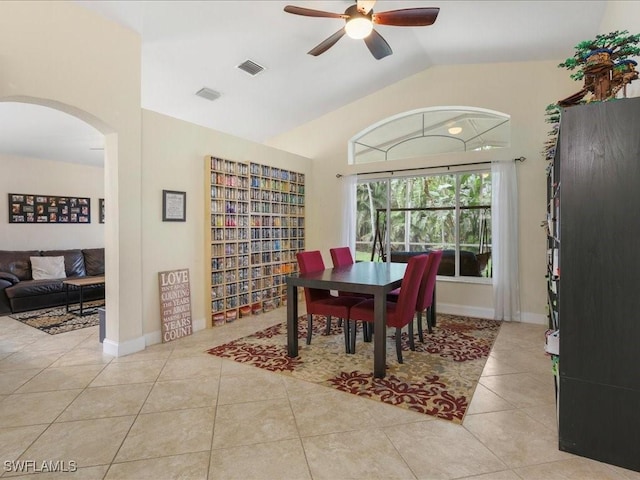 7930 Wexford Dr, Naples, FL 34104 - dining room with ceiling fan, arched walkways, lofted ceiling, and tile patterned flooring