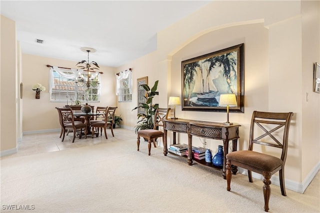3471 Ballybridge Cir Unit 202, Bonita Springs, FL 34134 - living area with a chandelier, light colored carpet, and baseboards