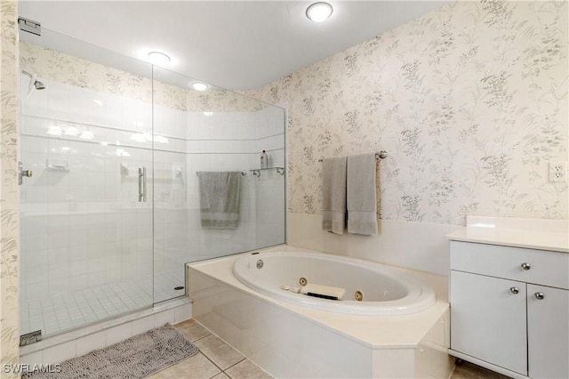 3471 Ballybridge Cir Unit 202, Bonita Springs, FL 34134 - bathroom with a jetted tub, a stall shower, tile patterned floors, vanity, and wallpapered walls