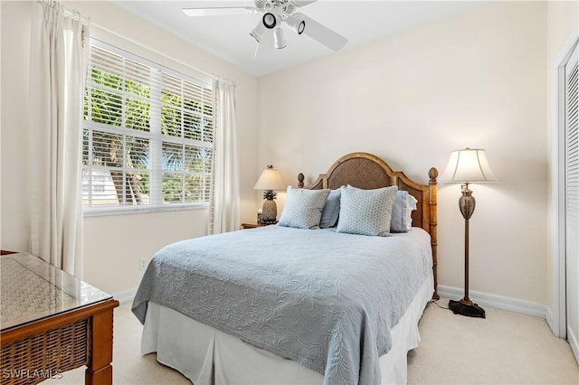 3471 Ballybridge Cir Unit 202, Bonita Springs, FL 34134 - bedroom featuring light colored carpet, baseboards, and ceiling fan