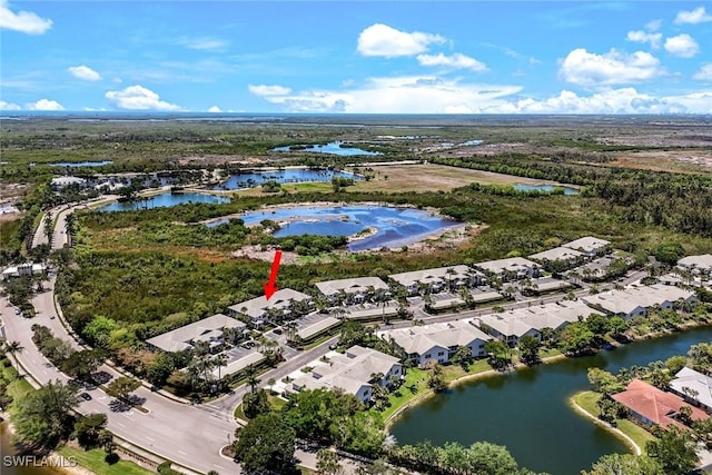 8315 Whisper Trace Way Unit C-102, Naples, FL 34114 - aerial view of residential area featuring a large body of water