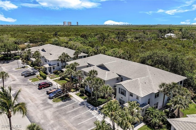 8315 Whisper Trace Way Unit C-102, Naples, FL 34114 - drone / aerial view of a heavily wooded area