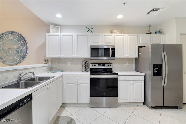 8315 Whisper Trace Way Unit C-102, Naples, FL 34114 - kitchen with stainless steel appliances, a sink, light countertops, backsplash, and recessed lighting