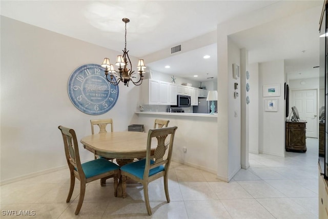 8315 Whisper Trace Way Unit C-102, Naples, FL 34114 - dining area with a chandelier, baseboards, light tile patterned flooring, and recessed lighting