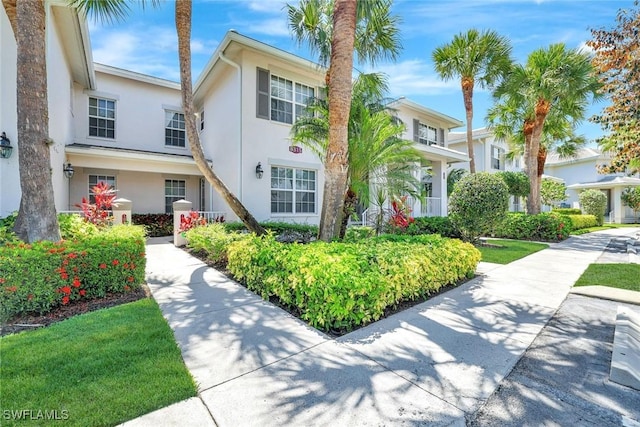 8315 Whisper Trace Way Unit C-102, Naples, FL 34114 - view of front facade with stucco siding