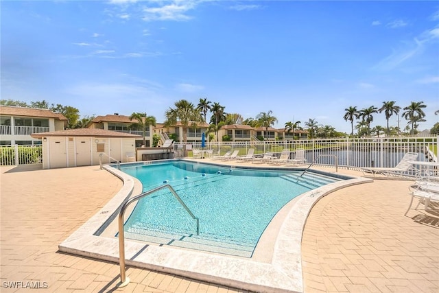 1155 Sandpiper St Unit G2, Naples, FL 34102 - community pool with fence and a patio