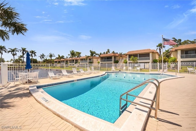 1155 Sandpiper St Unit G2, Naples, FL 34102 - community pool featuring fence and a patio area