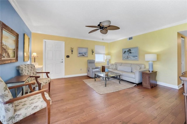 1155 Sandpiper St Unit G2, Naples, FL 34102 - living room with ceiling fan, wood finished floors, crown molding, and baseboards