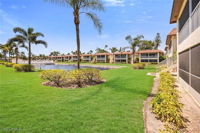 1155 Sandpiper St Unit G2, Naples, FL 34102 - view of grassy yard with a water view