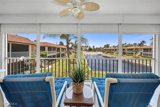 1155 Sandpiper St Unit G2, Naples, FL 34102 - sunroom with a water view, plenty of natural light, and a residential view