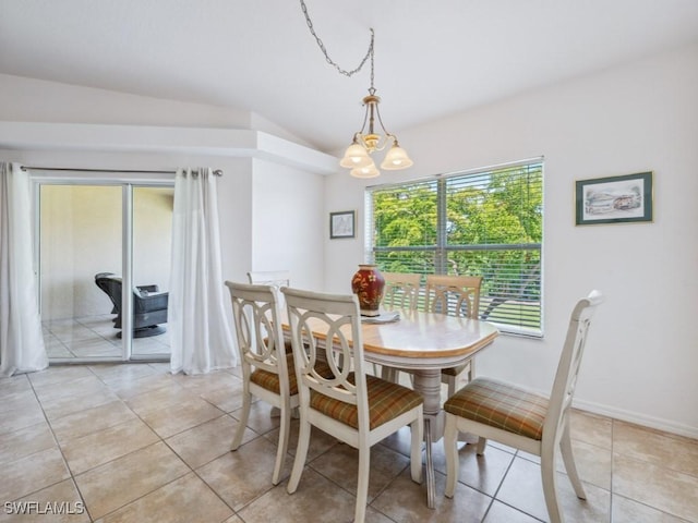 26660 Rosewood Pointe Cir Unit 205, Bonita Springs, FL 34135 - dining room featuring vaulted ceiling, a chandelier, and light tile patterned flooring