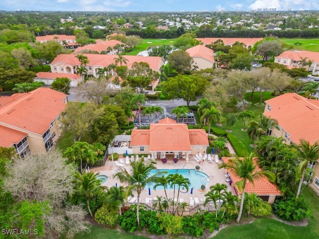 aerial view of residential area with a pool