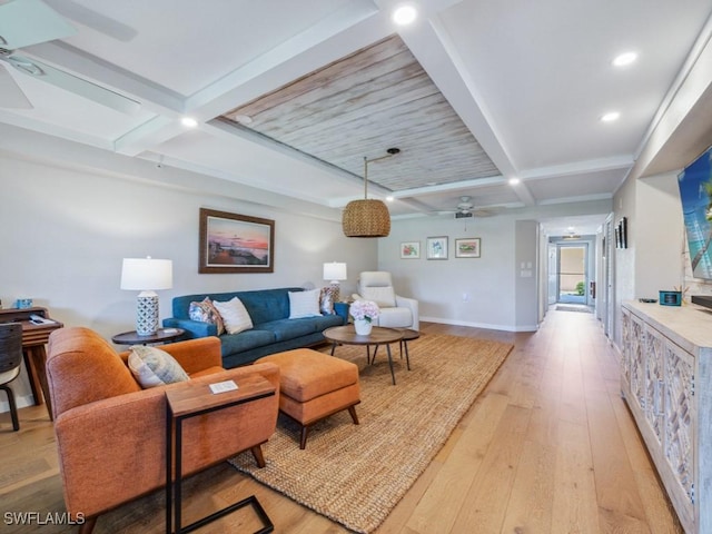 living room with a ceiling fan, light wood-type flooring, beamed ceiling, baseboards, and recessed lighting