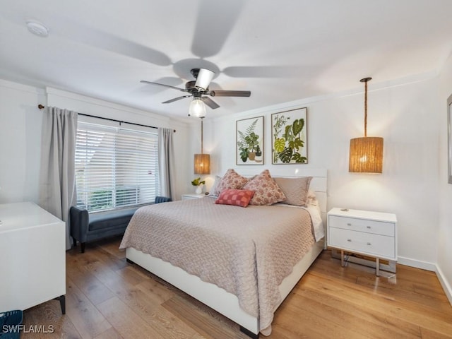 bedroom featuring light wood-style floors and ceiling fan