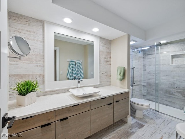 full bathroom with toilet, a stall shower, recessed lighting, vanity, and wood finished floors