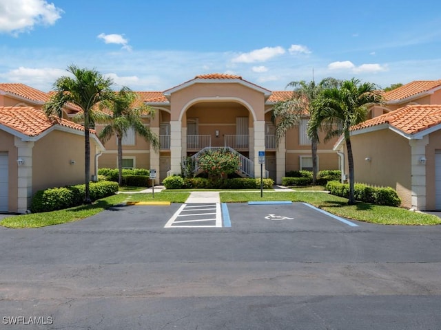 view of property featuring uncovered parking