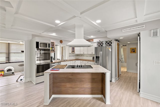 3275 Boca Ciega Dr Unit D49, Naples, FL 34112 - kitchen with appliances with stainless steel finishes, light wood-style flooring, white cabinets, coffered ceiling, and a kitchen island