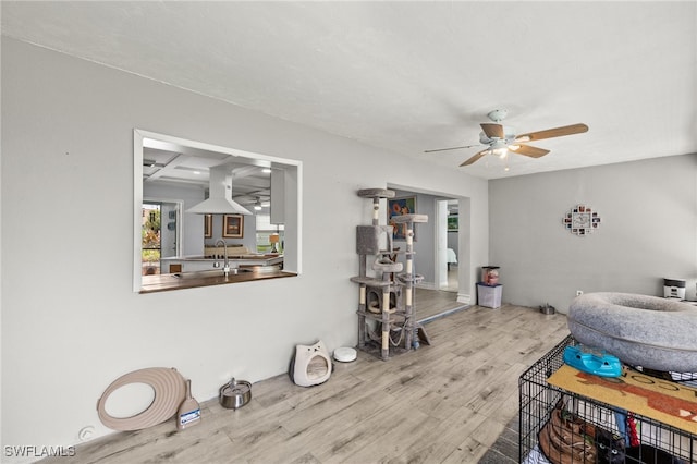 3275 Boca Ciega Dr Unit D49, Naples, FL 34112 - living room featuring ceiling fan and wood finished floors