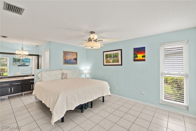 3275 Boca Ciega Dr Unit D49, Naples, FL 34112 - bedroom featuring multiple windows, a chandelier, baseboards, and ceiling fan