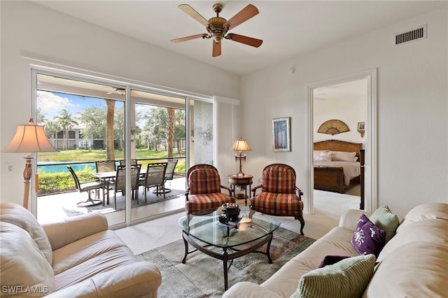 9224 Campanile Cir Unit 103, Naples, FL 34114 - carpeted living area with a ceiling fan