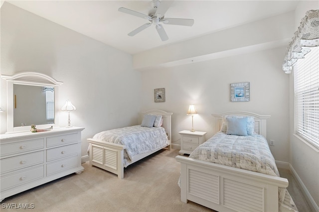 9224 Campanile Cir Unit 103, Naples, FL 34114 - bedroom featuring light carpet, baseboards, and ceiling fan